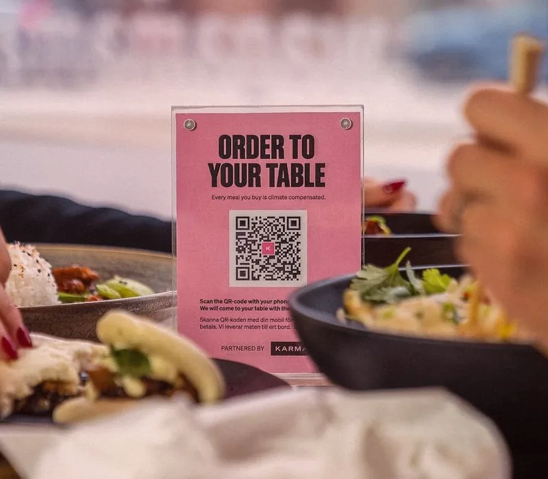 Karma's QR plate on a restaurant table